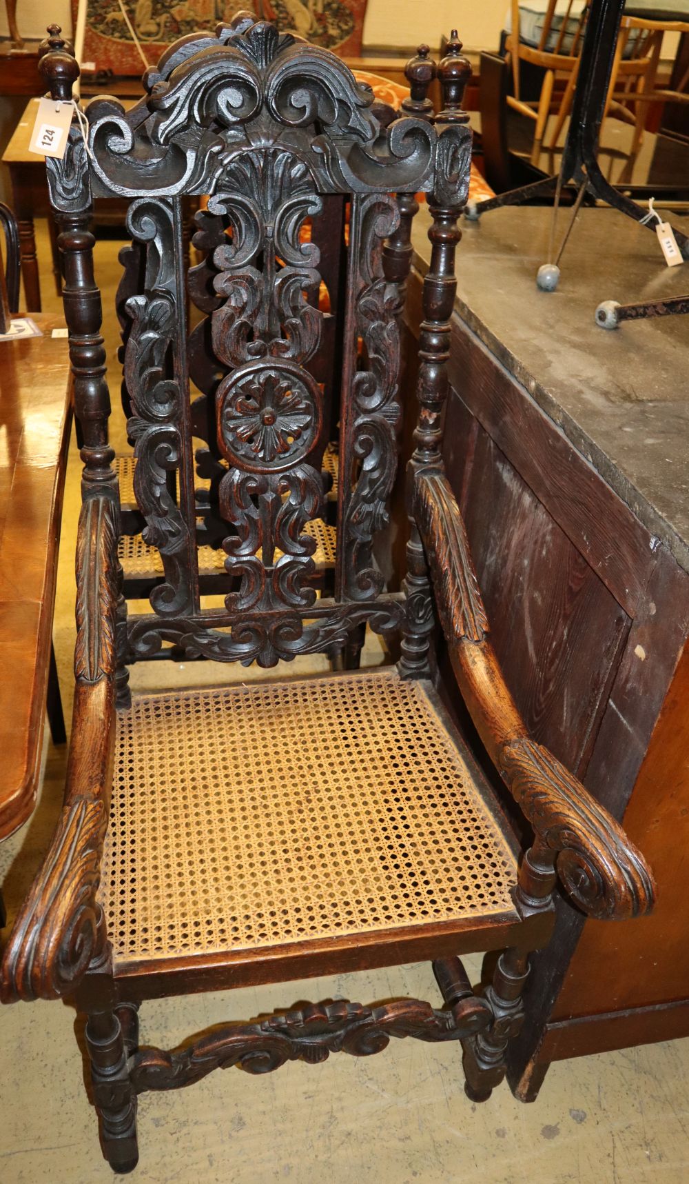 A pair of late 19th century Flemish carved oak cane seat elbow chairs, W.60cm, D.57cm, H.126cm